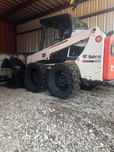 Photo of a bobcat skid steer in the parking garage
